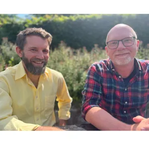 Two men sitting together